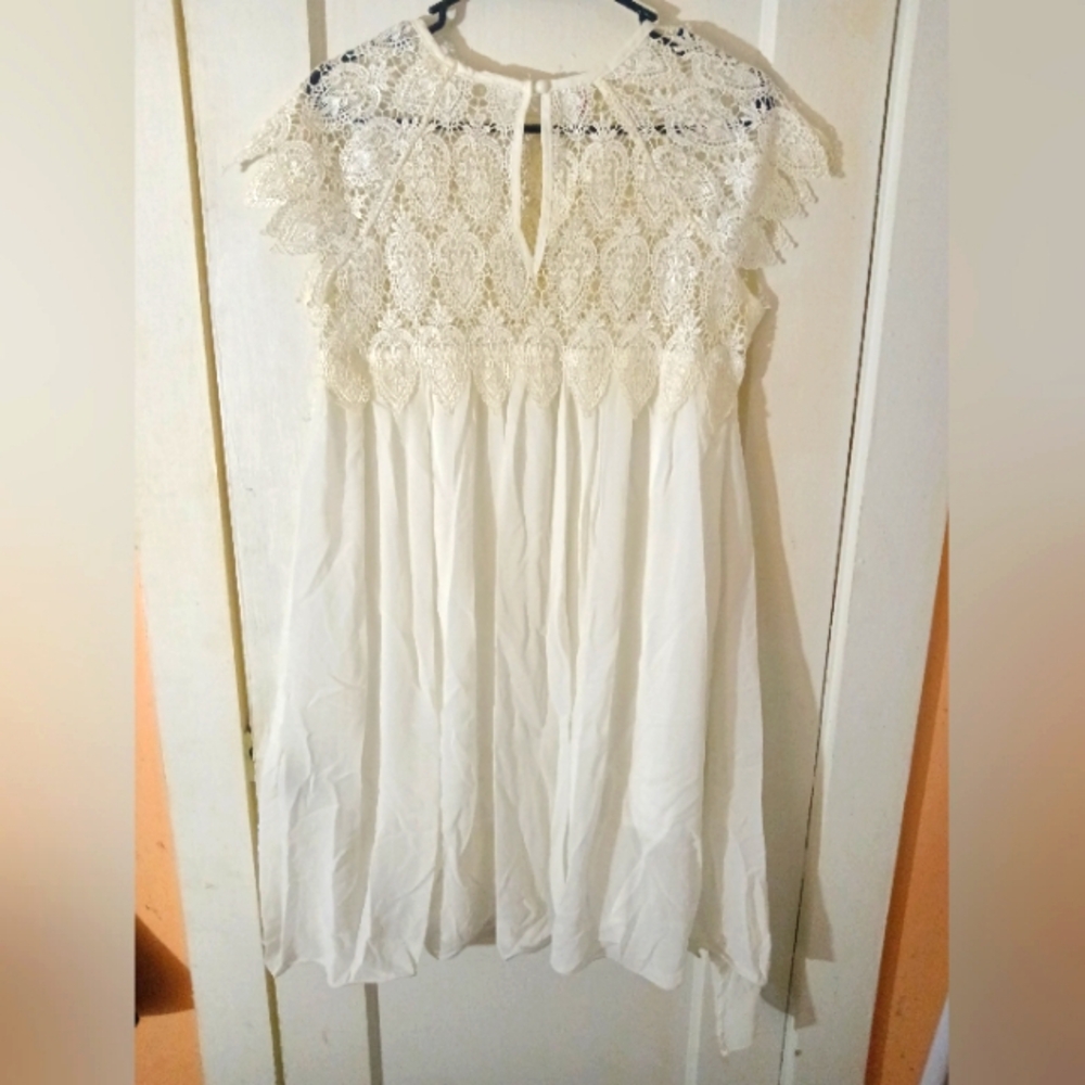 Lady's baby doll dress, white lace around neck and shoulders